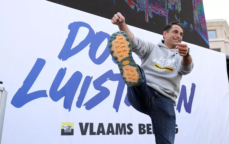 BRUSSELS, BELGIUM - MAY 29: Vlaams Belang chairman Tom Van Grieken shows his shoe during a speech at a protest meeting of Flemish far-right party Vlaams Belang in Brussels, Belgium on May 29, 2023. Opposing groups also held demonstrations, which led to heavy security measures. Dursun Aydemir / Anadolu Agency (Photo by Dursun Aydemir / ANADOLU AGENCY / Anadolu Agency via AFP)