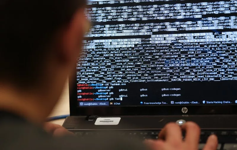 A student from an engineering school attends, on Meudon, west of Paris, overnight on March 16, 2013, the first edition of the Steria Hacking Challenge. AFP PHOTO / THOMAS SAMSON / AFP PHOTO / THOMAS SAMSON