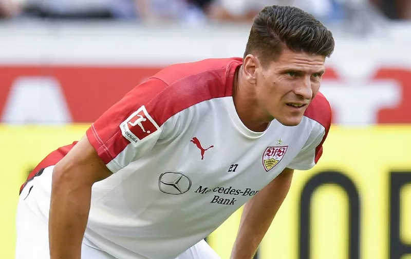 Stuttgart's forward Mario Gomez warms up prior to a pre-season friendly football match between VfB Stuttgart and Atletico Madrid in Stuttgart, southwestern Germany, on August 5, 2018. - Gomez announced his retirement from the German national football team on August 5, 2018. (Photo by THOMAS KIENZLE / AFP)