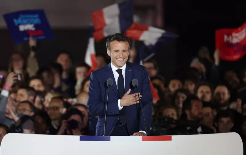 French President and La Republique en Marche (LREM) party candidate for re-election Emmanuel Macron celebrates after his victory in France's presidential election, at the Champ de Mars in Paris, on April 24, 2022. (Photo by Thomas COEX / AFP)