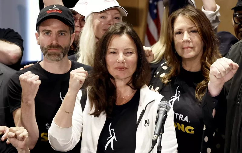 LOS ANGELES, CALIFORNIA - JULY 13: (L-R) Ben Whitehair, Frances Fisher, SAG President Fran Drescher, Joely Fisher, National Executive Director, and SAG-AFTRA members are seen as SAG-AFTRA National Board holds a press conference for vote on recommendation to call a strike regarding the TV/Theatrical contract at SAG-AFTRA on July 13, 2023 in Los Angeles, California.   Frazer Harrison/Getty Images/AFP (Photo by Frazer Harrison / GETTY IMAGES NORTH AMERICA / Getty Images via AFP)