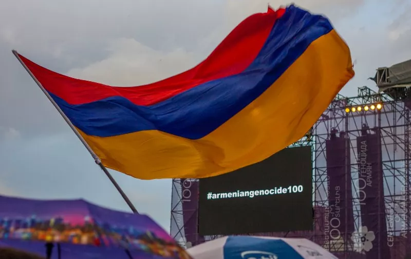 ARMENIA, Yerevan : The picture shows the armenian flag and a screen reading #armeniangenocide100 in front of the System of a down stage on April 23, 2015. The rock band gave a free concert on Yerevan Republic square for the armenian genocide centenary.  - CITIZENSIDE/TATEVIK VARDANYAN