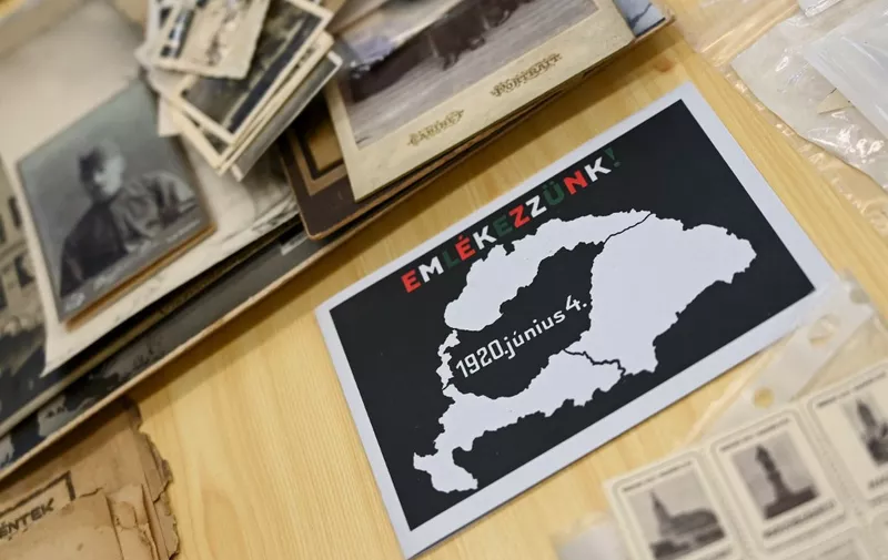Csaba Pal Szabo, director of a state-financed Trianon Museum, poses during an interview with AFP journalists on May 25, 2020 in Szeged, Hungary, ahead of the 100 years since Treaty of Trianon. A picture taken on May 25, 2020 in Szeged, Hungary, shows a map with the limits Hungary before and after WWI. (Photo by ATTILA KISBENEDEK / AFP)