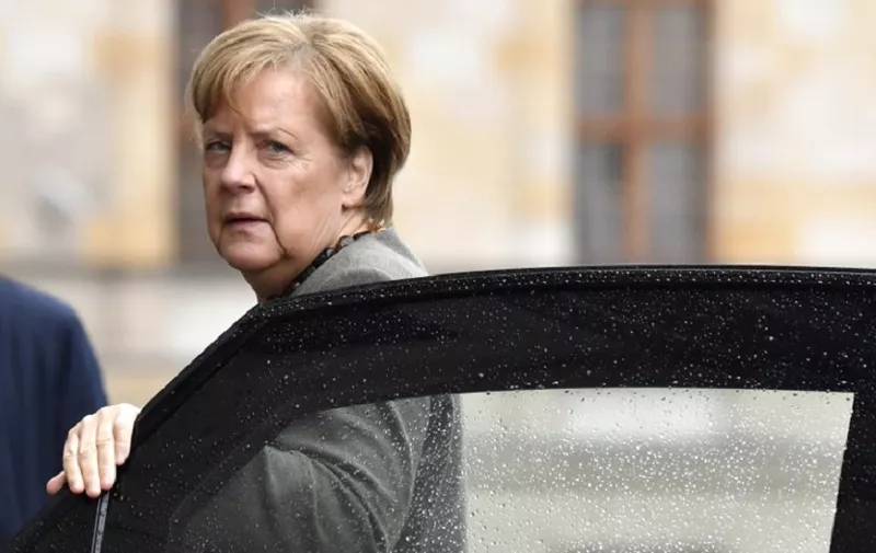 German Chancellor and leader of the Christian Democratic Union (CDU) party, Angela Merkel arrives for exploratory talks with members of possible coalition parties to form a new government on November 2, 2017 in Berlin. / AFP PHOTO / John MACDOUGALL