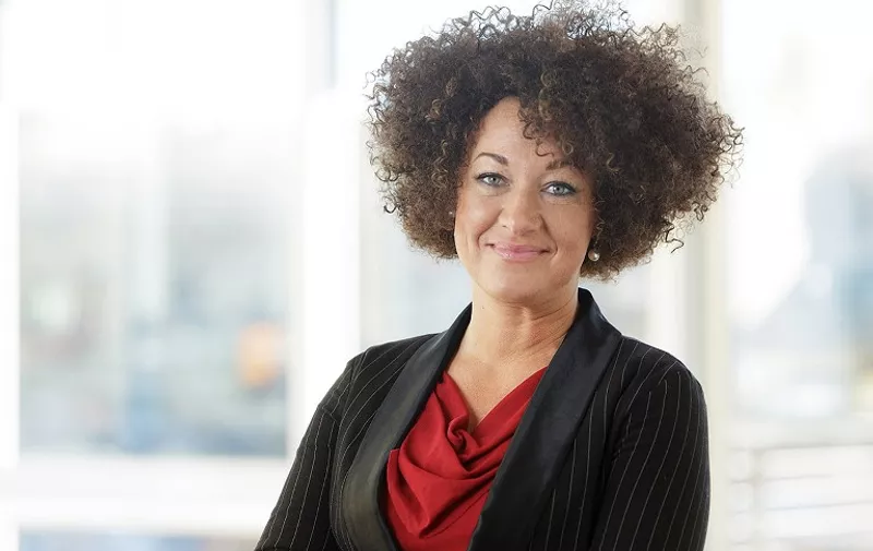 This February 12, 2014 photo courtesy of Inlander shows Rachel Dolezal at the Inlander offices in Spokane, Washington. The white parents of a civil rights activist who has raised a national stir by portraying herself as black needs counseling to address her identity issues, her mother said June 15, 2015. The comments by the parents of Rachel Dolezal, who are estranged from her, came as it emerged Dolezal herself has cancelled a public appearance Monday at which she was to have tried to clear up all the confusion. With coils of dark hair and tawny skin, Dolezal, 37, built a career as an activist in the black community of Spokane, Washington.
She is the local chapter president of the National Organization for the Advancement of Colored People, America's oldest and largest advocacy group for African-Americans.    AFP PHOTO/ HANDOUT / YOUNG KWAK / INLANDER        =  RESTRICTED TO EDITORIAL USE / MANDATORY CREDIT: "AFP PHOTO HANDOUT / YOUNG KWAK / INALNDER "/ NO MARKETING - NO ADVERTISING CAMPAIGNS / DISTRIBUTED AS A SERVICE TO CLIENTS /(NO A LA CARTE SALES )(NO ARCHIVES)=