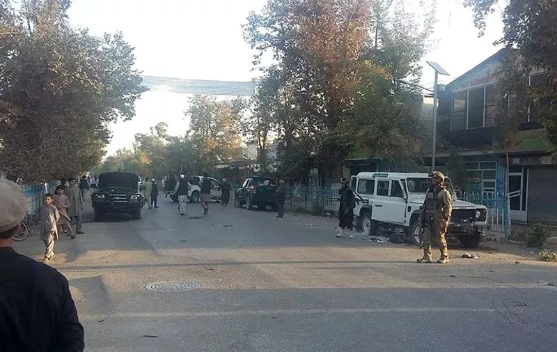 Afghan security forces keep watch in the streets after retaking control of Kunduz city from the Taliban militants in northeastern Kunduz province, on October 1, 2015.  Afghan forces retook control of the strategic northern city of Kunduz on October 1 after a three-day Taliban occupation that dealt a stinging blow to the country's NATO-trained military.    AFP PHOTO