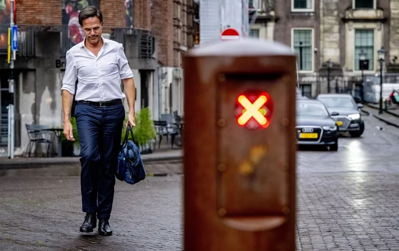 Dutch Prime Minister Mark Rutte arrives at General Affairs for a consultation on the approach to asylum, in The Hague, on July 5, 2023. The government is under great pressure due to difficult negotiations on a migration package, in which the curtailment of the influx of asylum seekers in particular is leading to major tensions between the four coalition parties. (Photo by Robin Utrecht / ANP / AFP) / Netherlands OUT