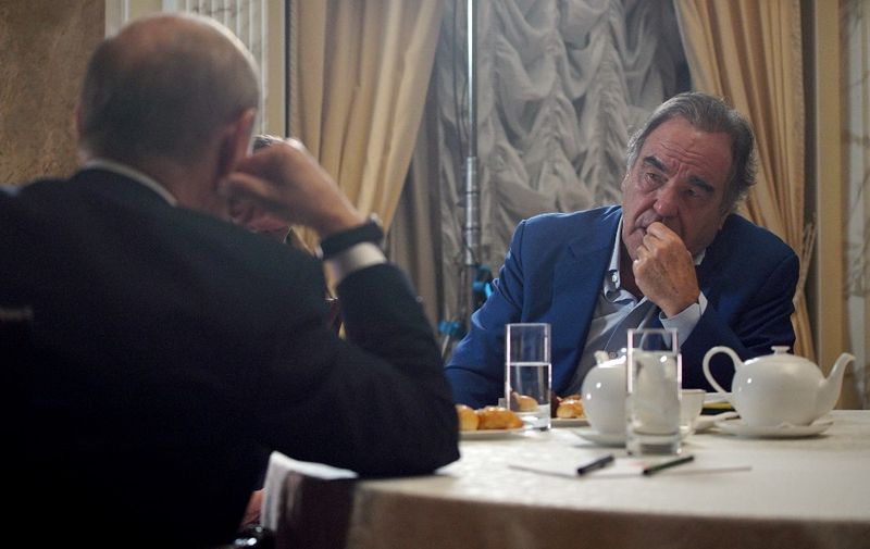 In this picture taken on June 19, 2019 US film director Oliver Stone interviews Russian President Vladimir Putin in Moscow. (Photo by Alexey DRUZHININ / SPUTNIK / AFP)