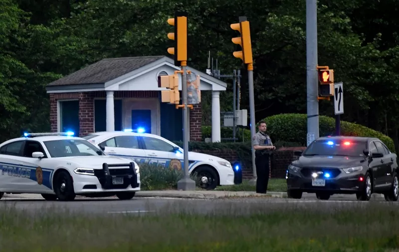 Police cars are seen outside the CIA headquarters's gate after an attempted intrusion earlier in the day in Langley, Virginia, on May 3, 2021. - An armed person was shot by FBI agents Monday after a standoff of several hours at the entry gate to the CIA headquarters, the federal investigation agency said.
The unidentified person was prevented from driving past the initial gate into the CIA's sprawling wooded compound just outside Washington early Monday afternoon. (Photo by Olivier DOULIERY / AFP)