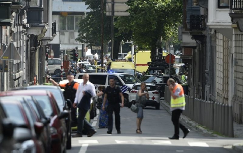 Police and ambulance are seen at the site where a gunman shot dead three people, two of them policemen, before being killed by elite officers, in the eastern Belgian city of Liege on May 29, 2018. 
The shooting occurred around 10:30am (0830 GMT) on a major artery in the city close to a high school. "We don't know anything yet," the spokeswoman for the Liege prosecutors office, told AFP when asked about the shooter's motives. / AFP PHOTO / JOHN THYS