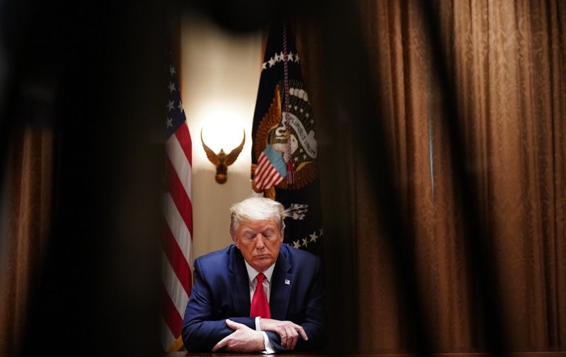 US President Donald Trump speaks during a meeting with healthcare executives in the Cabinet Room of the White House in Washington, DC on April 14, 2020. (Photo by MANDEL NGAN / AFP)