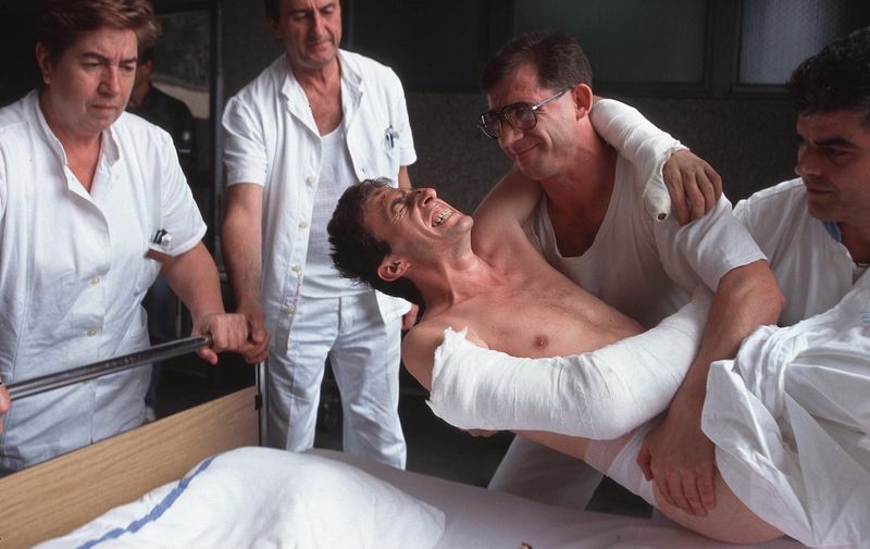 A wounded Croatian man in pain is lowered into a hospital bed in Vukovar, Croatia, which was attacked for three months by Serbian forces and was the last major city to fall before the end of the Croatian war, Aug. 29, 1991. Over 10,000 people were killed in the war between Croatia and Yugoslavia., Image: 116177654, License: Rights-managed, Restrictions: Content available for editorial use, pre-approval required for all other uses.
This content not available to be downloaded through Quick Pic
Not available for license and invoicing to customers located in the Czech Republic.
Not available for license and invoicing to customers located in the Netherlands.
Not available for license and invoicing to customers located in India.
Not available for license and invoicing to customers located in Finland.
Not available for license and invoicing to customers located in Italy., Model Release: no, Credit line: Profimedia, Corbis VII