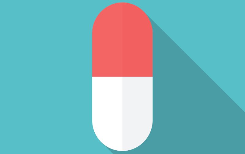 Drug icon with long shadow. Flat design style. Pill silhouette. Simple icon. Modern flat icon in stylish colors. Web site page and mobile app design element.