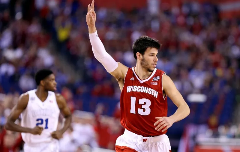 INDIANAPOLIS, IN - APRIL 06: Duje Dukan #13 of the Wisconsin Badgers reacts after a play in the first half against the Duke Blue Devils during the NCAA Men's Final Four National Championship at Lucas Oil Stadium on April 6, 2015 in Indianapolis, Indiana.   Streeter Lecka/Getty Images/AFP