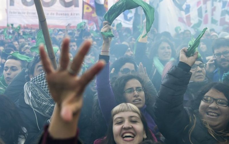 Pro-choice activists react outside the Argentine Congress in Buenos Aires, on June 14, 2018, shortly after lawmakers approved a bill to legalize abortion. 
Lawmakers in Pope Francis' native Argentina on Thursday narrowly approved a bill to legalize abortion during the first 14 weeks of pregnancy. The lower house Chamber of Deputies passed the bill by 129 votes to 125. The bill now goes before the Senate.
 / AFP PHOTO / EITAN ABRAMOVICH