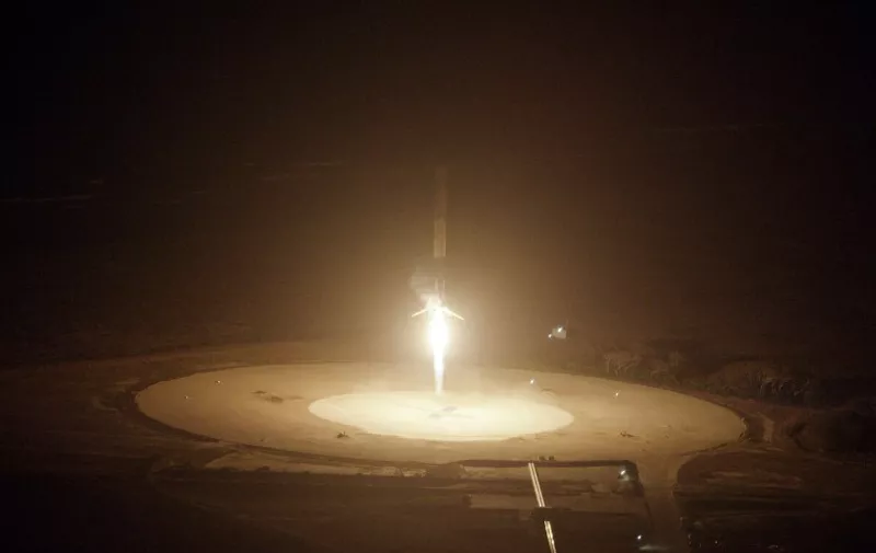 This image obtained courtesy of  SpaceX shows the first-stage successful upright landing of the SpaceX  Falcon 9 rocket on Monday, December 21, 2015 at Cape Canaveral Air Force Station in Florida,  an historic first in the company's bid to make rockets as reusable as airplanes.  The company, headed by Internet tycoon Elon Musk, is striving to revolutionize the rocket industry, which currently loses many millions of dollars in jettisoned machinery and sophisticated rocket components after each launch. Several attempts to land the Falcon 9's first stage on a floating ocean platform have failed -- with the rocket either colliding with the autonomous drone ship or tipping over. But SpaceX has insisted that each attempt has helped engineers come closer to perfecting the technique.    AFP PHOTO / SPACEX     == RESTRICTED TO EDITORIAL  USE / MANDATORY CREDIT:  "AFP PHOTO / SPACEX" /  NO SALES / NO MARKETING / NO ADVERTISING CAMPAIGNS / DISTRIBUTED AS A SERVICE TO CLIENTS == / AFP / SPACEX / -