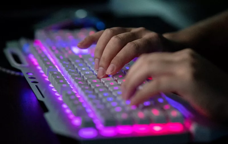 This photo taken on August 4, 2020 shows Prince, a member of the hacking group Red Hacker Alliance who refused to give his real name, using his computer at their office in Dongguan, China's southern Guangdong province. From a small, dingy office tucked away in an industrial city in southern China, one of China's last "volunteer hacker" groups maintains a final outpost in its patriotic hacking war. (Photo by NICOLAS ASFOURI / AFP) / TO GO WITH China-hacking-security,FOCUS by Laurie Chen / The erroneous mention[s] appearing in the metadata of this photo by NICOLAS ASFOURI has been modified in AFP systems in the following, we removed the HOLD HOLD HOLD in the main caption.   Please immediately remove the erroneous mention[s] from all your online services and delete it (them) from your servers. If you have been authorized by AFP to distribute it (them) to third parties, please ensure that the same actions are carried out by them. Failure to promptly comply with these instructions will entail liability on your part for any continued or post notification usage. Therefore we thank you very much for all your attention and prompt action. We are sorry for the inconvenience this notification may cause and remain at your disposal for any further information you may require.