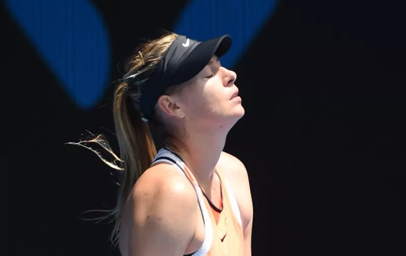 Russia's Maria Sharapova reacts during her women's singles match against Serena Williams of the US on day nine of the 2016 Australian Open tennis tournament in Melbourne on January 26, 2016. AFP PHOTO / WILLIAM WEST-- IMAGE RESTRICTED TO EDITORIAL USE - STRICTLY NO COMMERCIAL USE / AFP / WILLIAM WEST
