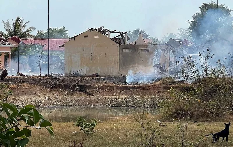 Smoke billows from the warehouse following an explosion at an army base in Kampong Speu province on April 27, 2024. Twenty Cambodian soldiers have been killed in an ammunition explosion at an army base, Prime Minister Hun Manet said on April 27. The blast at around 2.45pm (0745 GMT) at the army base in Kampong Speu province to the west of the capital also wounded several soldiers, according to the PM, with the army saying that an entire truck of munitions had exploded. (Photo by AFP)