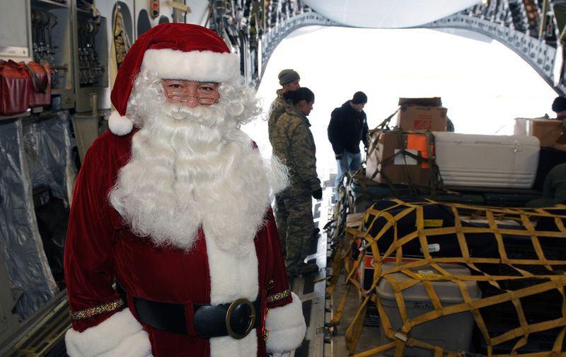 Santa Claus aboard an Alaska Air National Guard C-17 Globemaster military transport aircraft on St. Paul Island, Alaska, on Nov. 6, 2010, after a successful visit to residents as part of the Alaska National Guard's Operation Santa Claus annual outreach to the state's remote communities. (U.S. Army photo by Staff Sgt. Jim Greenhill) (Released)