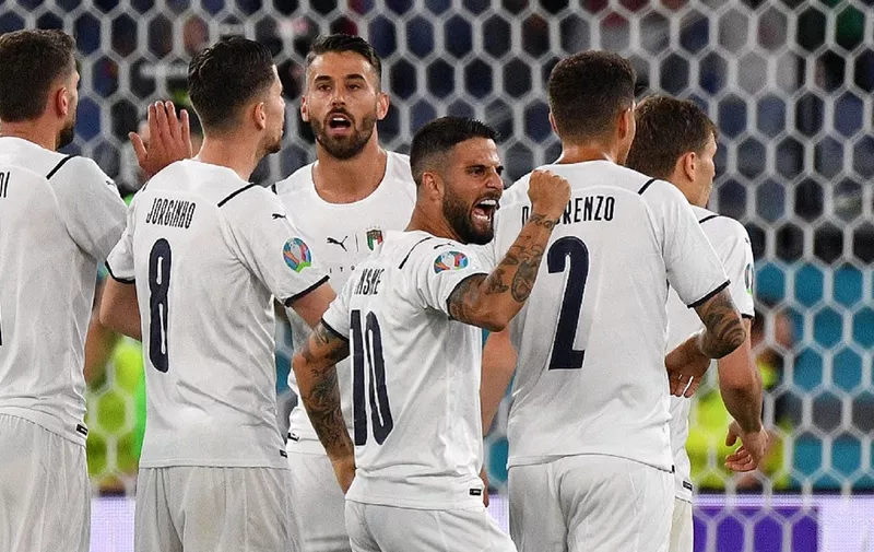 Italy's forward Lorenzo Insigne (C) and teammates celebrate Turkey's owngoal scored by Turkey's defender Merih Demiral during the UEFA EURO 2020 Group A football match between Turkey and Italy at the Olympic Stadium in Rome on June 11, 2021. (Photo by Filippo MONTEFORTE / POOL / AFP)