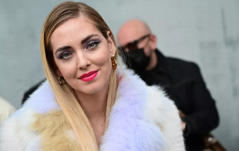 (FILES) Italian blogger Chiara Ferragni poses prior to the Fendi catwalk show for the Women Fall/Winter 2022/2023 collection on the second day of the Milan Fashion Week in Milan on February 23, 2022. Italy's Instagram star Chiara Ferragni is being investigated for fraud over a charity cake deal in which she suggested erroneously that the proceeds would help children with bone cancer. The fashion entrepreneur with 29.5 million followers on Instagram is at the heart of a scandal surrounding her 2022 endorsement of a pandoro cake -- a Christmas treat similar to a panettone -- purportedly to raise funds for children undergoing treatment at a Turin hospital. (Photo by MIGUEL MEDINA / AFP)