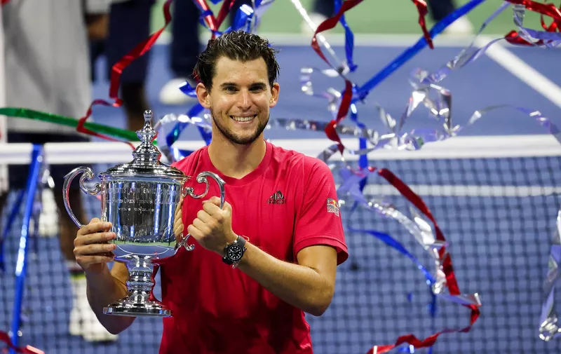 NEW YORK, NEW YORK - SEPTEMBER 13: Dominic Thiem of Austria celebrates with the championship trophy after winning in a tie-breaker during his Men's Singles final match against Alexander Zverev of Germany on Day Fourteen of the 2020 US Open at the USTA Billie Jean King National Tennis Center on September 13, 2020 in the Queens borough of New York City. (Photo by Al Bello/Getty Images)