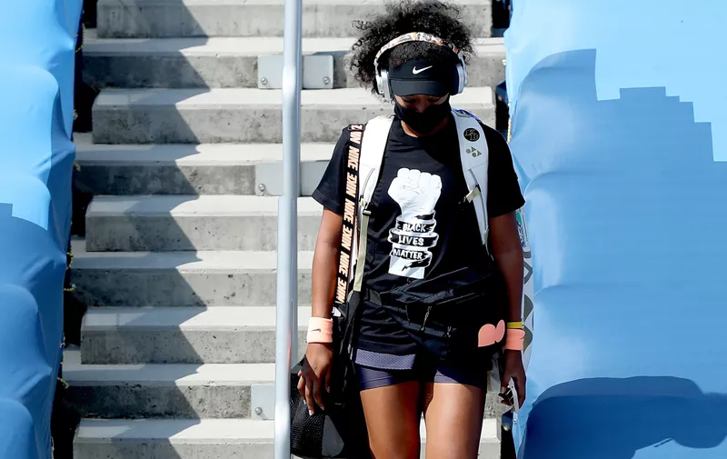 NEW YORK, NEW YORK - AUGUST 28:  Naomi Osaka of Japan makes her way to the court for her semifinal match against Elise Mertens of Belgium during the Western &amp; Southern Open at the USTA Billie Jean King National Tennis Center on August 28, 2020 in the Queens borough of New York City. (Photo by Matthew Stockman/Getty Images)