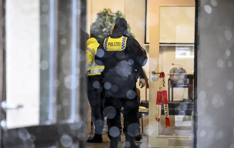 Police works at the site where several people have been killed in a church in a shooting the night before in Hamburg, northern Germany on March 10, 2023. - A shooting at a Jehovah's Witness centre in the German city of Hamburg has left eight people dead, including the suspected gunman, police said on March 10, 2023. (Photo by Tobias SCHWARZ / AFP)