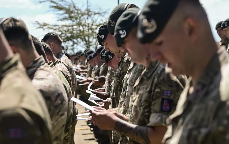 Units of the British Army Training Unit in Kenya (BATUK) attend a special service in honour of  the late Britain's Queen Elizabeth II at their barracks in Nanyuki town, on the slopes of Mt. Kenya on September 19, 2022 where the then princess Elizabeth ascended the throne following the death of her father, King George VI, while she was visiting Kenya. (Photo by Tony Karumba / AFP)
